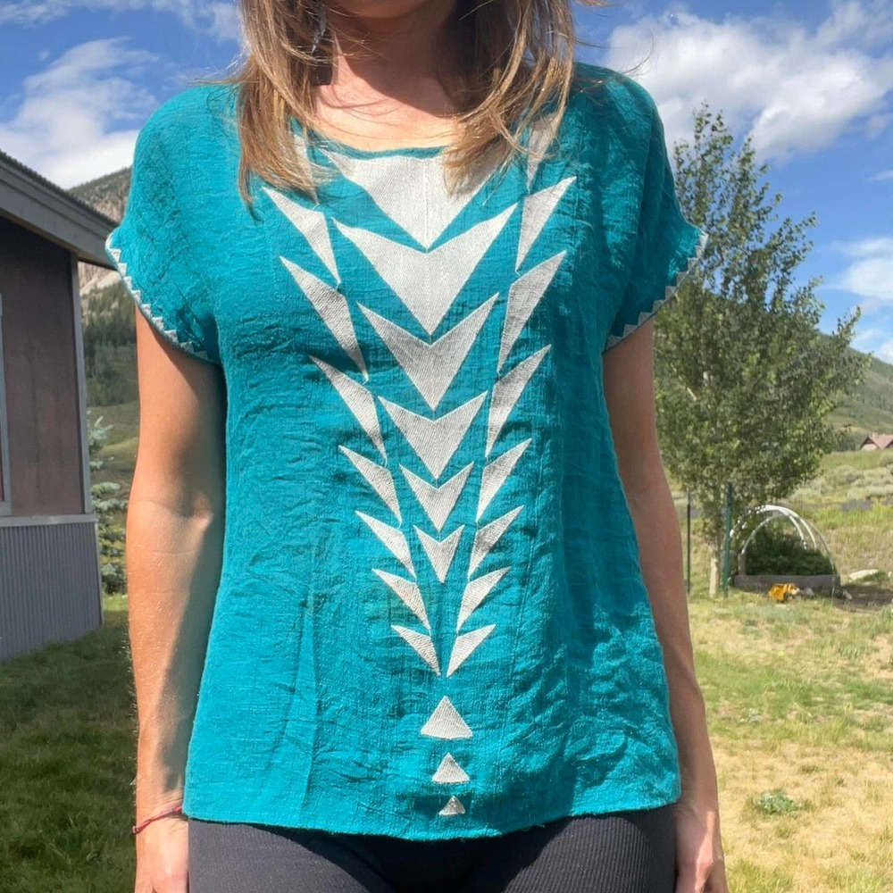 Turquoise shirt with geometric
